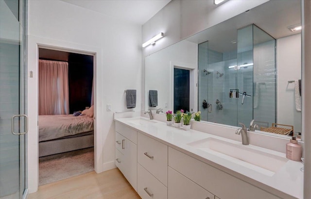 6612 Vista Vly, Windsor, WI 53598 - ensuite bathroom with double vanity, a shower stall, and wood finished floors