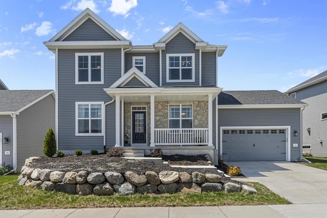 432 Tawny Elm Pkwy, Verona, WI 53593 - view of front of home featuring a porch, driveway, an attached garage, and stone siding