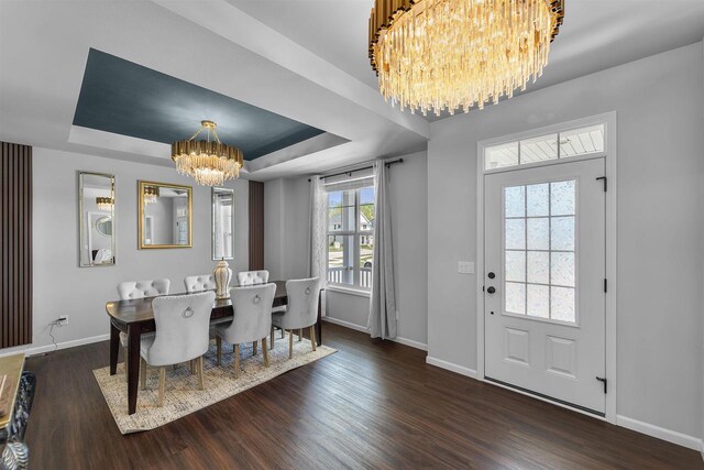 432 Tawny Elm Pkwy, Verona, WI 53593 - dining space with a chandelier, wood finished floors, baseboards, and a tray ceiling