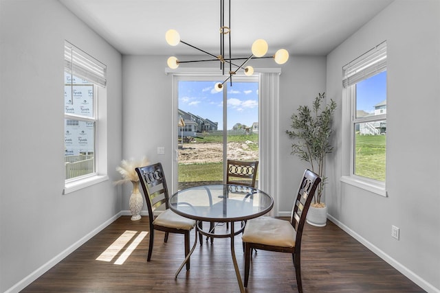 432 Tawny Elm Pkwy, Verona, WI 53593 - dining space with plenty of natural light, a chandelier, dark wood-type flooring, and baseboards