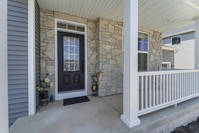 432 Tawny Elm Pkwy, Verona, WI 53593 - doorway to property with stone siding and a porch
