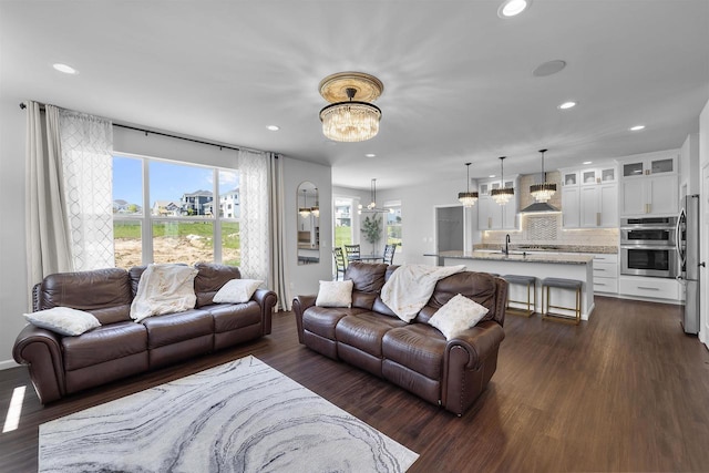 432 Tawny Elm Pkwy, Verona, WI 53593 - living room featuring a chandelier, recessed lighting, and dark wood finished floors