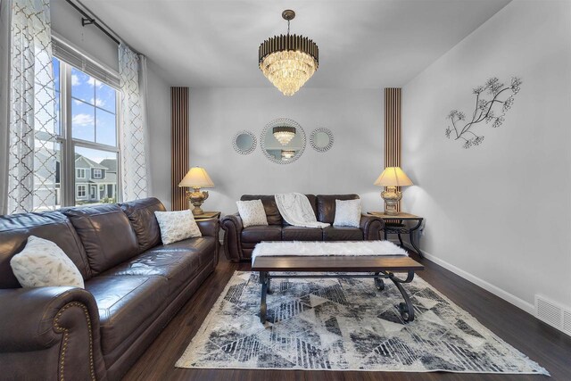 432 Tawny Elm Pkwy, Verona, WI 53593 - living area featuring a chandelier, baseboards, and wood finished floors