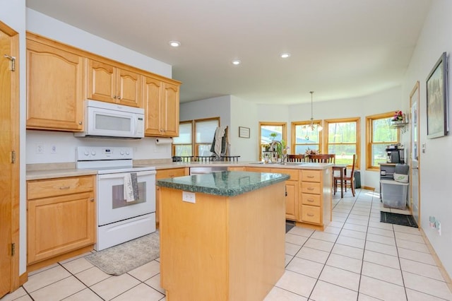 175545 Willow Ln, Ringle, WI 54440 - kitchen featuring white appliances, a peninsula, light tile patterned floors, a center island, and light brown cabinetry