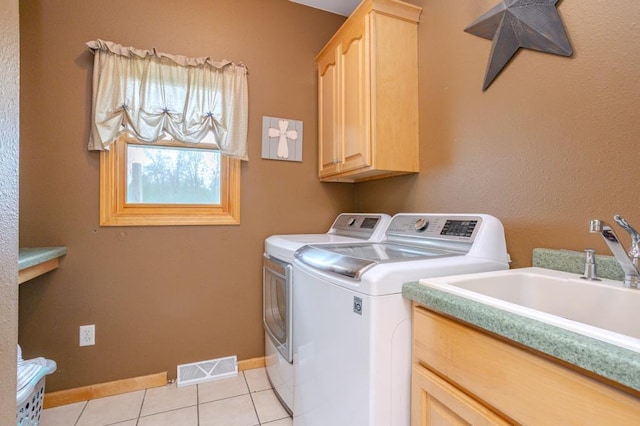 175545 Willow Ln, Ringle, WI 54440 - laundry area featuring cabinet space, washing machine and dryer, light tile patterned floors, and baseboards