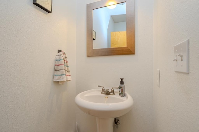 175545 Willow Ln, Ringle, WI 54440 - bathroom featuring a textured wall and a sink