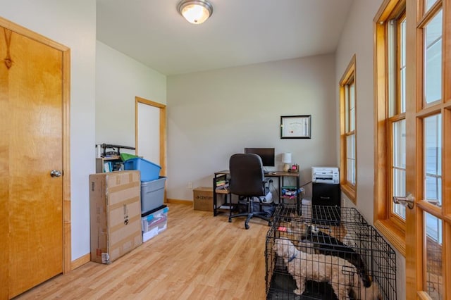 175545 Willow Ln, Ringle, WI 54440 - office featuring wood finished floors, plenty of natural light, baseboards, and french doors