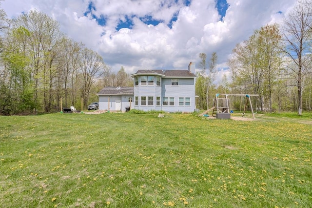 175545 Willow Ln, Ringle, WI 54440 - back of house featuring a playground, a chimney, and a lawn