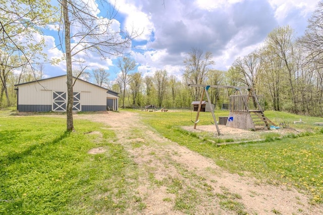 175545 Willow Ln, Ringle, WI 54440 - view of green lawn featuring a playground and an outbuilding