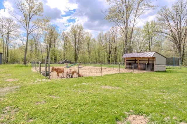 175545 Willow Ln, Ringle, WI 54440 - view of yard with an outbuilding, an exterior structure, and a trampoline