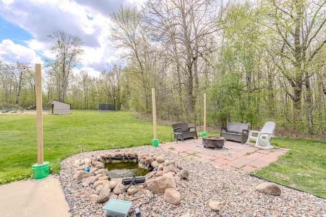 175545 Willow Ln, Ringle, WI 54440 - view of green lawn with an outdoor fire pit and a patio area
