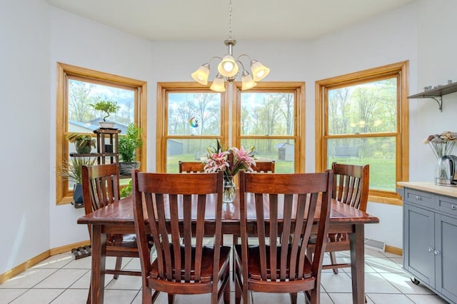 175545 Willow Ln, Ringle, WI 54440 - dining space with a chandelier, light tile patterned floors, and baseboards