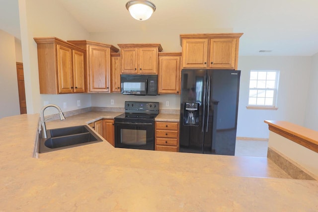 6313 43rd St Unit 162, Kenosha, WI 53144 - kitchen with black appliances, a sink, and light countertops