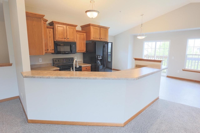 6313 43rd St Unit 162, Kenosha, WI 53144 - kitchen featuring black appliances, light countertops, vaulted ceiling, hanging light fixtures, and light carpet
