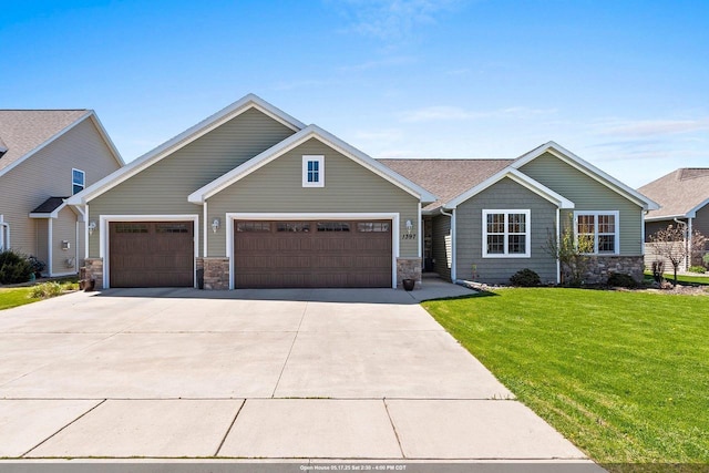 1397 Lear Ln, De Pere, WI 54115 - craftsman inspired home featuring driveway, stone siding, an attached garage, and a front yard