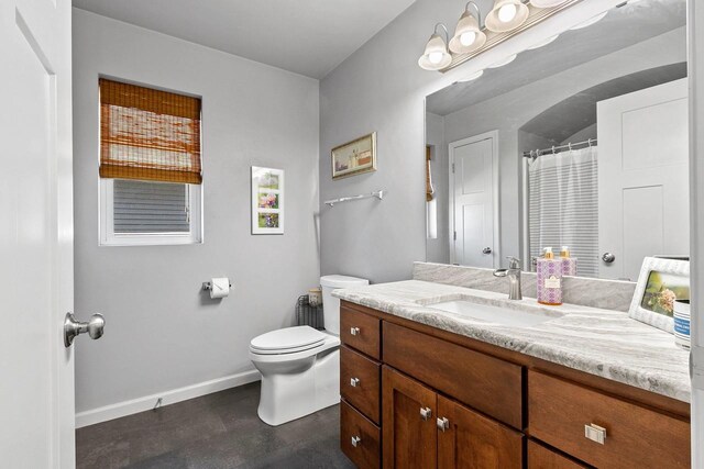 1397 Lear Ln, De Pere, WI 54115 - bathroom with toilet, baseboards, and vanity