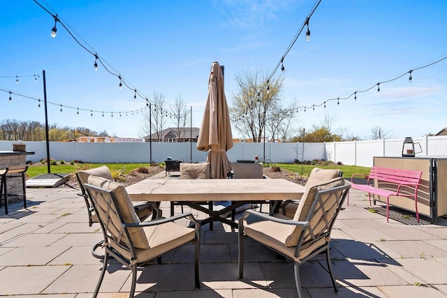 1397 Lear Ln, De Pere, WI 54115 - view of patio with outdoor dining area and a fenced backyard