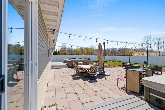 1397 Lear Ln, De Pere, WI 54115 - view of patio with outdoor dining area and a fenced backyard