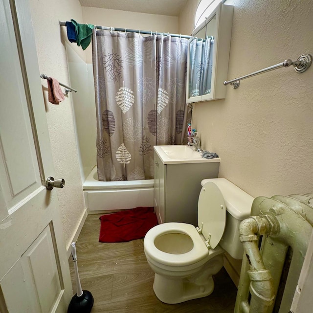 2664 N Booth St, Milwaukee, WI 53212 - bathroom featuring wood finished floors, toilet, a textured wall, shower / bath combo with shower curtain, and vanity