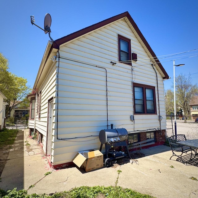 2664 N Booth St, Milwaukee, WI 53212 - rear view of house featuring fence and a patio