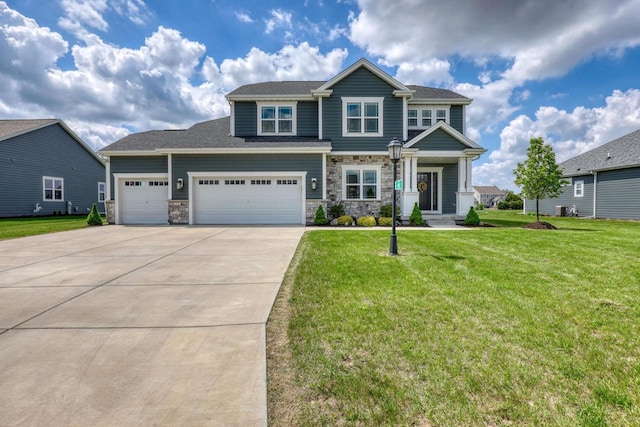 craftsman-style house with driveway, a front lawn, stone siding, and a garage