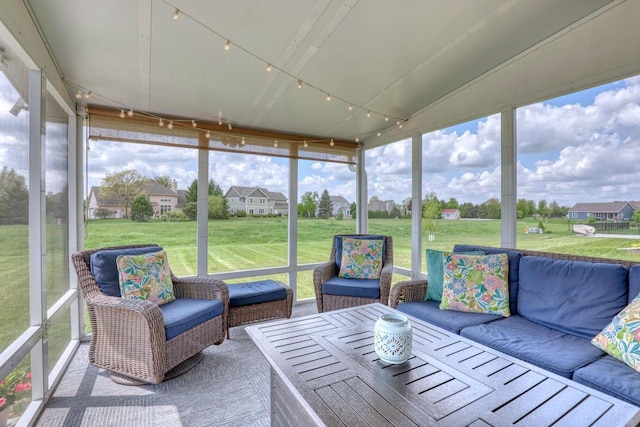 sunroom featuring a residential view