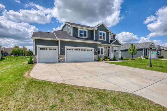 craftsman-style house featuring concrete driveway, stone siding, a front lawn, and a garage