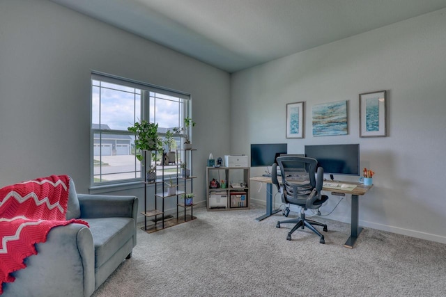 carpeted office featuring baseboards
