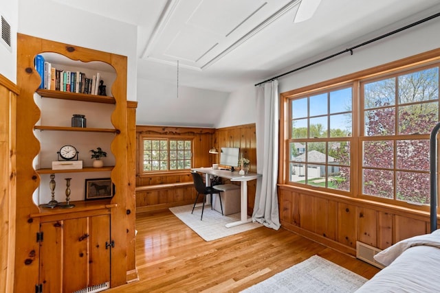 2577 N 89th St, Wauwatosa, WI 53226 - bedroom featuring attic access, light wood-style flooring, lofted ceiling, and wood walls