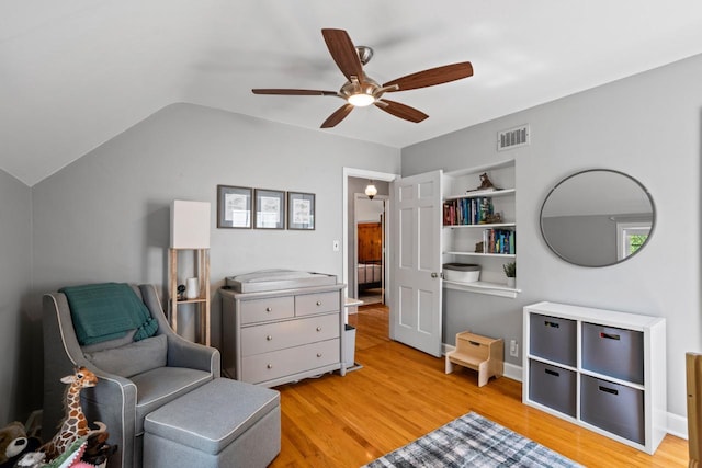2577 N 89th St, Wauwatosa, WI 53226 - living area with ceiling fan, light wood-style floors, and lofted ceiling