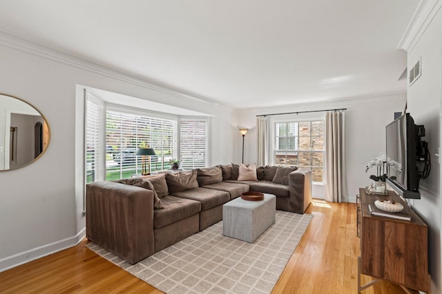 2577 N 89th St, Wauwatosa, WI 53226 - living room featuring ornamental molding, light wood-style floors, and baseboards