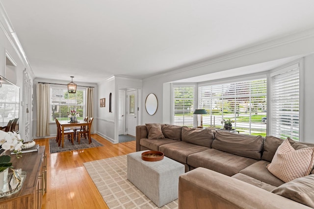 2577 N 89th St, Wauwatosa, WI 53226 - living room featuring crown molding, light wood finished floors, plenty of natural light, and baseboards