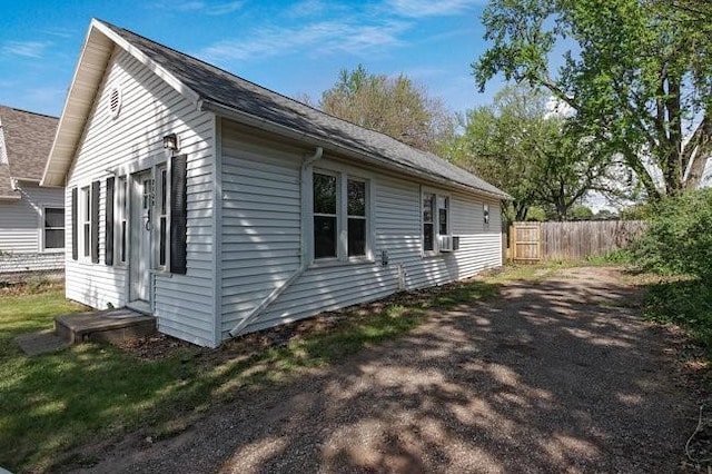 2139 12th St, Eau Claire, WI 54703 - view of side of home featuring fence