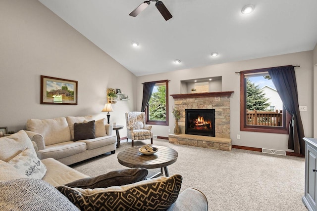 N5798 Lakeview Dr, Green Lake, WI 54941 - carpeted living area featuring baseboards, ceiling fan, a stone fireplace, recessed lighting, and lofted ceiling