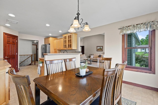 N5798 Lakeview Dr, Green Lake, WI 54941 - dining area featuring baseboards, a chandelier, and recessed lighting