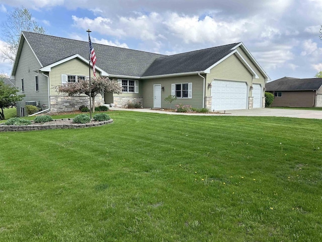 N5798 Lakeview Dr, Green Lake, WI 54941 - ranch-style house with driveway, an attached garage, a front yard, stone siding, and roof with shingles