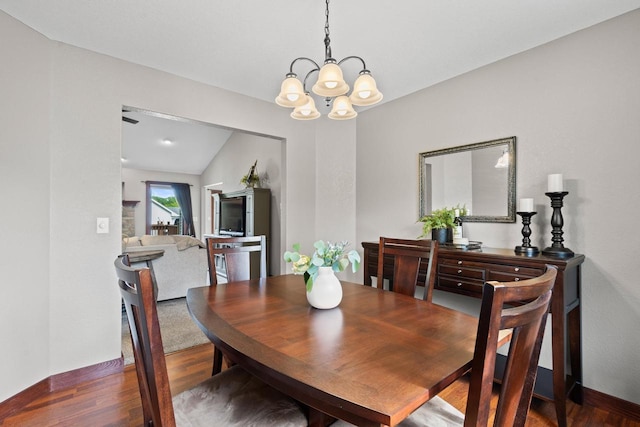 N5798 Lakeview Dr, Green Lake, WI 54941 - dining space featuring a chandelier, wood finished floors, and baseboards