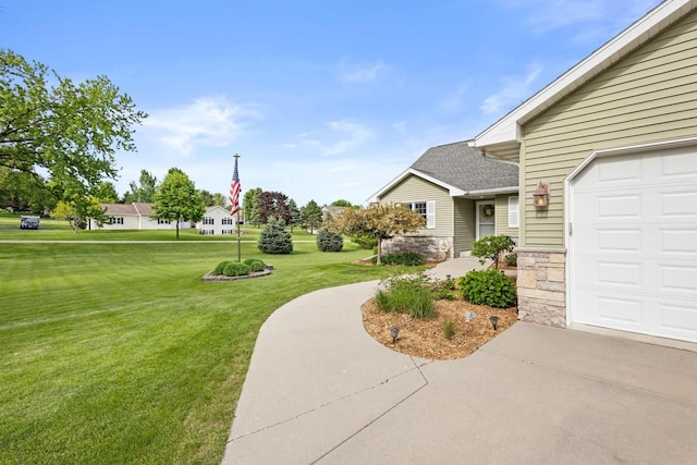 N5798 Lakeview Dr, Green Lake, WI 54941 - view of green lawn with a garage