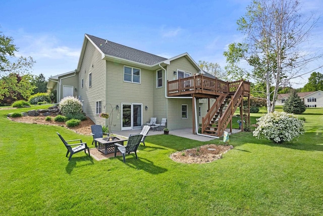 N5798 Lakeview Dr, Green Lake, WI 54941 - back of house with a fire pit, a deck, stairway, a lawn, and a patio area