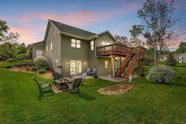 N5798 Lakeview Dr, Green Lake, WI 54941 - back of house with a fire pit, stairs, a wooden deck, a yard, and a patio