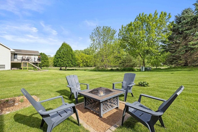 N5798 Lakeview Dr, Green Lake, WI 54941 - view of grassy yard with an outdoor fire pit and stairway