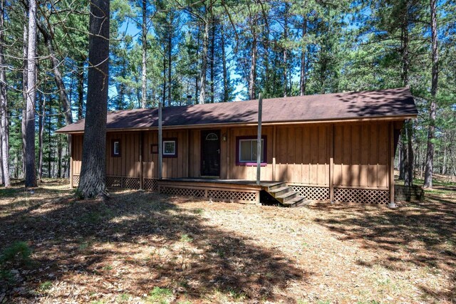 984 E Trout Valley Rd, Friendship, WI 54646 - view of front of house with board and batten siding, a porch, and a shingled roof
