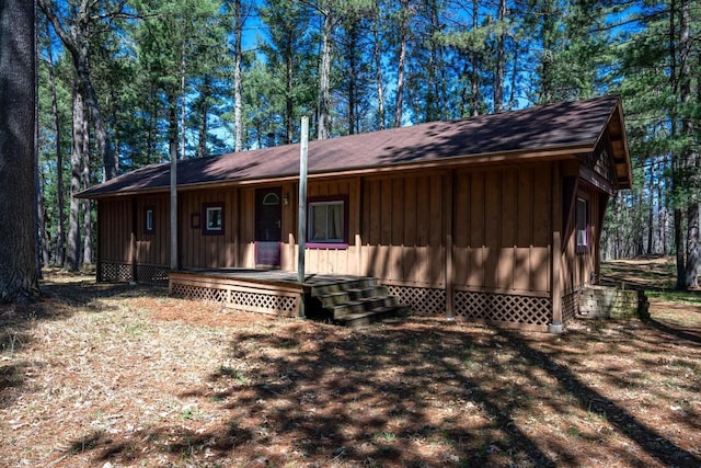 984 E Trout Valley Rd, Friendship, WI 54646 - view of front facade with board and batten siding, covered porch, and a shingled roof