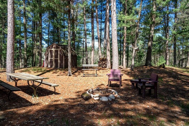 984 E Trout Valley Rd, Friendship, WI 54646 - view of yard with an outdoor fire pit, a shed, and an outdoor structure