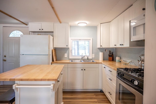 984 E Trout Valley Rd, Friendship, WI 54646 - kitchen featuring wood counters, a sink, white appliances, and backsplash