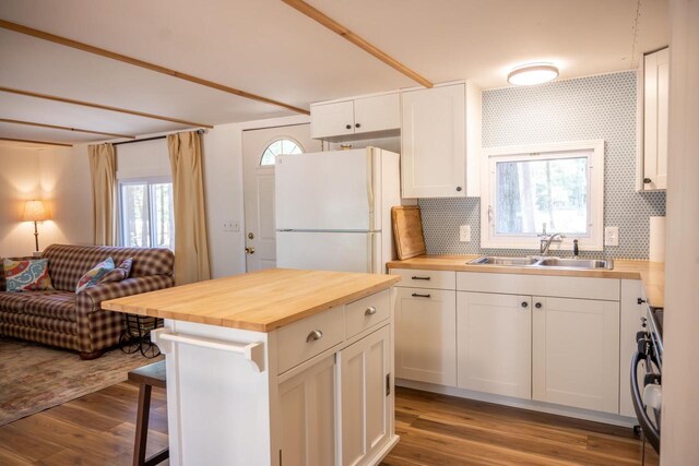 984 E Trout Valley Rd, Friendship, WI 54646 - kitchen with butcher block countertops, a sink, freestanding refrigerator, and open floor plan