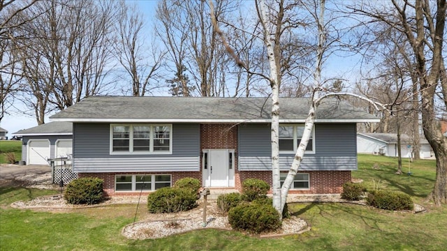 912 S 3rd Ave, Edgar, WI 54426 - raised ranch featuring a front yard and brick siding