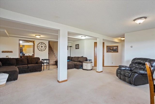 912 S 3rd Ave, Edgar, WI 54426 - living area featuring carpet, stairs, a textured ceiling, and baseboards