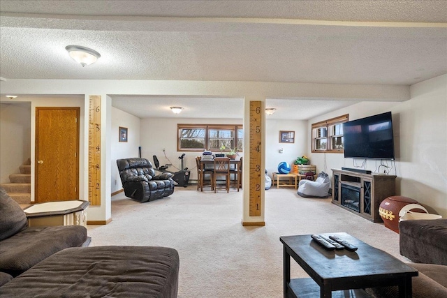 912 S 3rd Ave, Edgar, WI 54426 - carpeted living area featuring healthy amount of natural light, stairs, a fireplace, and baseboards