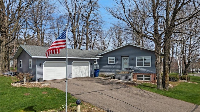 912 S 3rd Ave, Edgar, WI 54426 - view of front of house with an attached garage, driveway, and a front yard